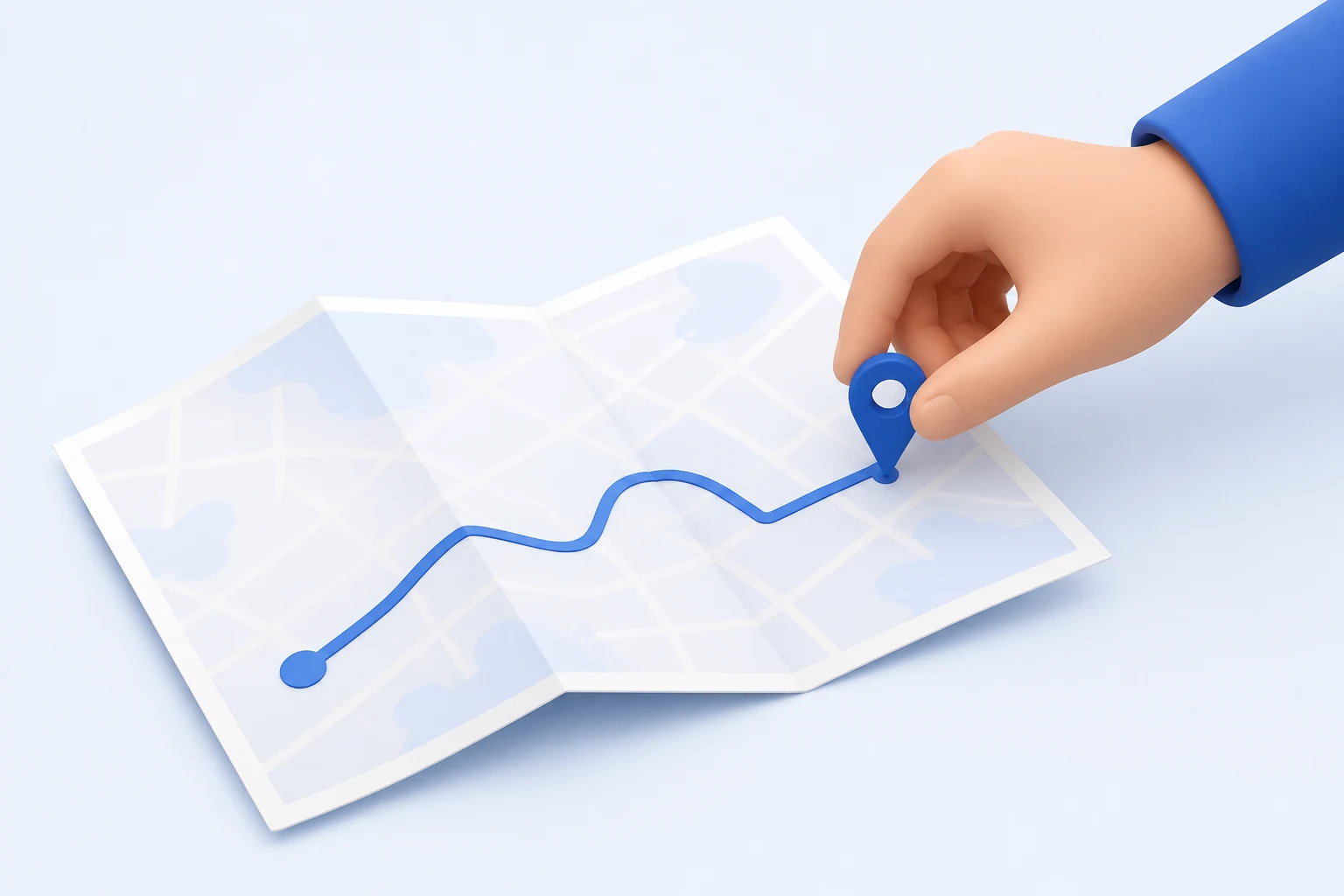A hand presses a single blue map pin into the end of a plain route line drawn across an open folded paper map lying on a light surface